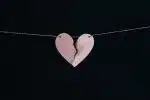 broken heart hanging on wire