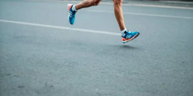 pair of blue-and-white Adidas running shoes